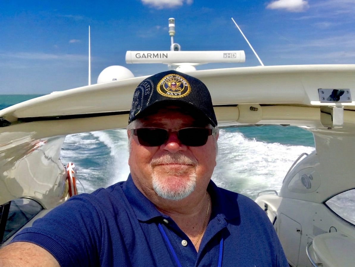 Captain Carl McBride at the helm on open water.